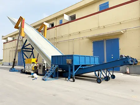 Truck tipper with conveyor and hopper.webp